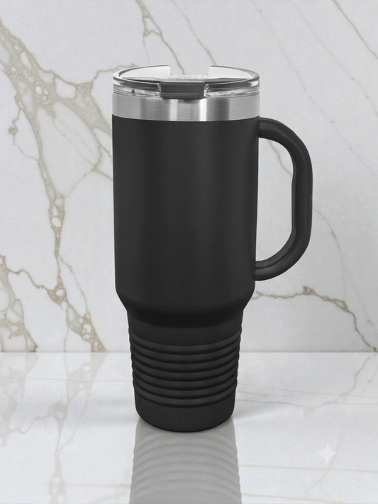 Black travel mug with a silver lid on a marble surface