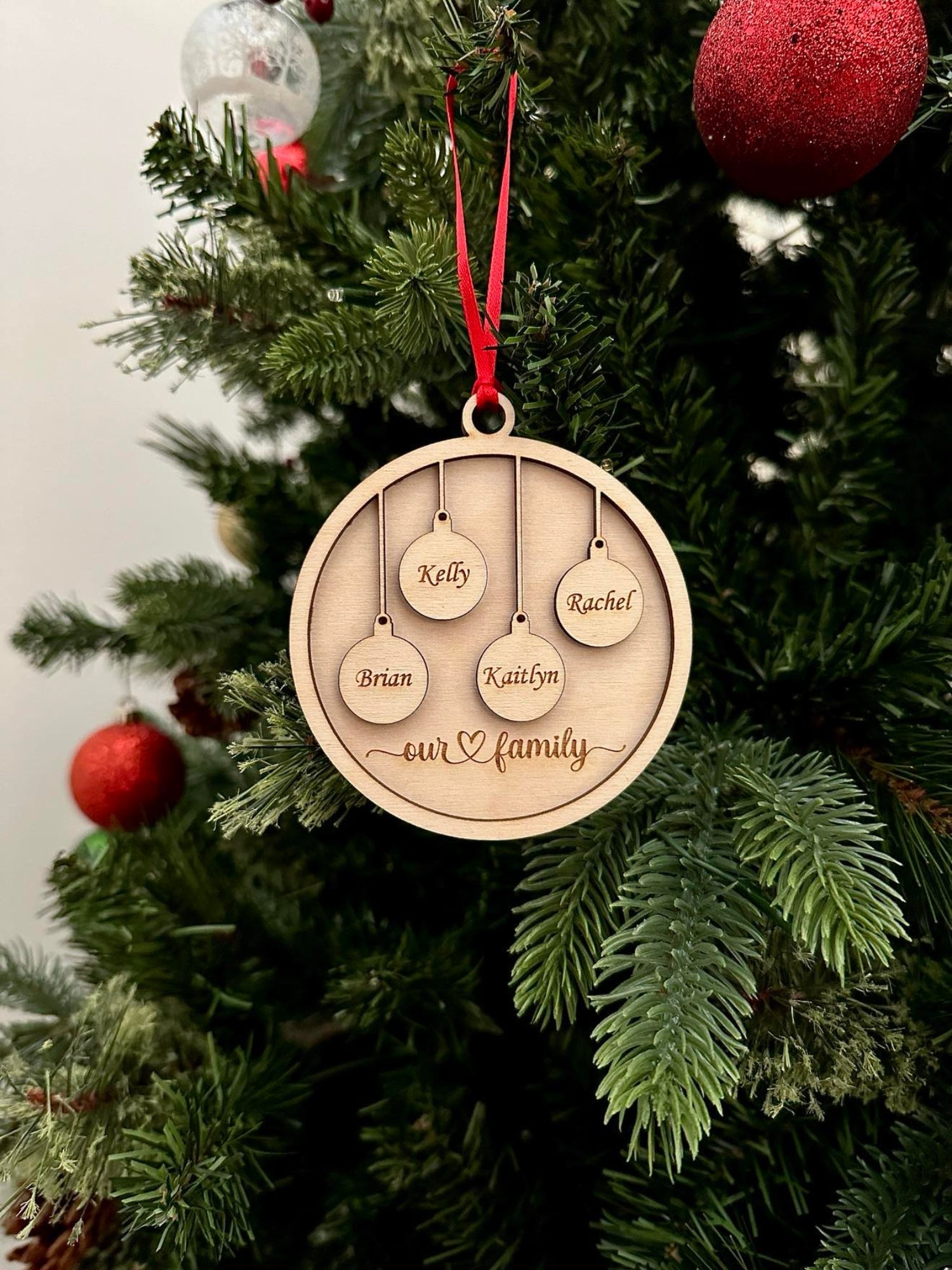 Personalized Our Family Wooden Ornament — Laser Engraved with Family Names & Pet Paw Prints