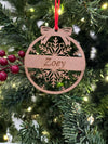 Decorative Christmas ornament with 'Zoey' on a tree